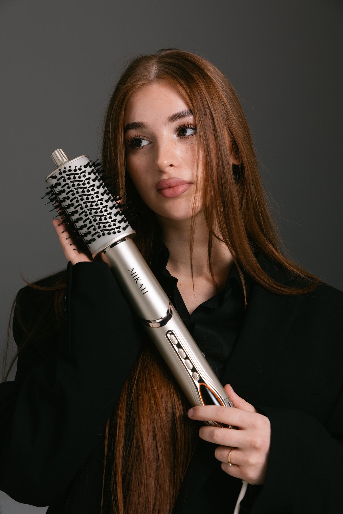 MIKAH 6-in-1 Air Styler shown during an everyday hair styling routine