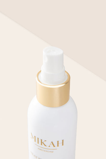 Close-up of MIKAH Heat &amp; Scalp Protection Spray bottle