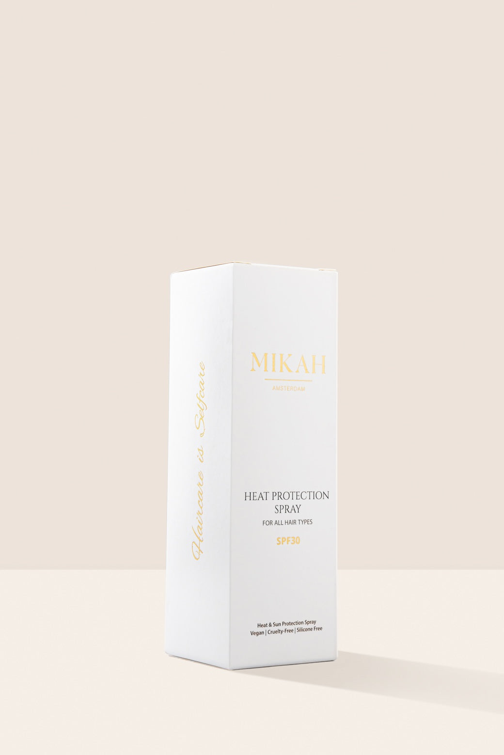 MIKAH Heat &amp; Scalp Protection Spray with white product packaging