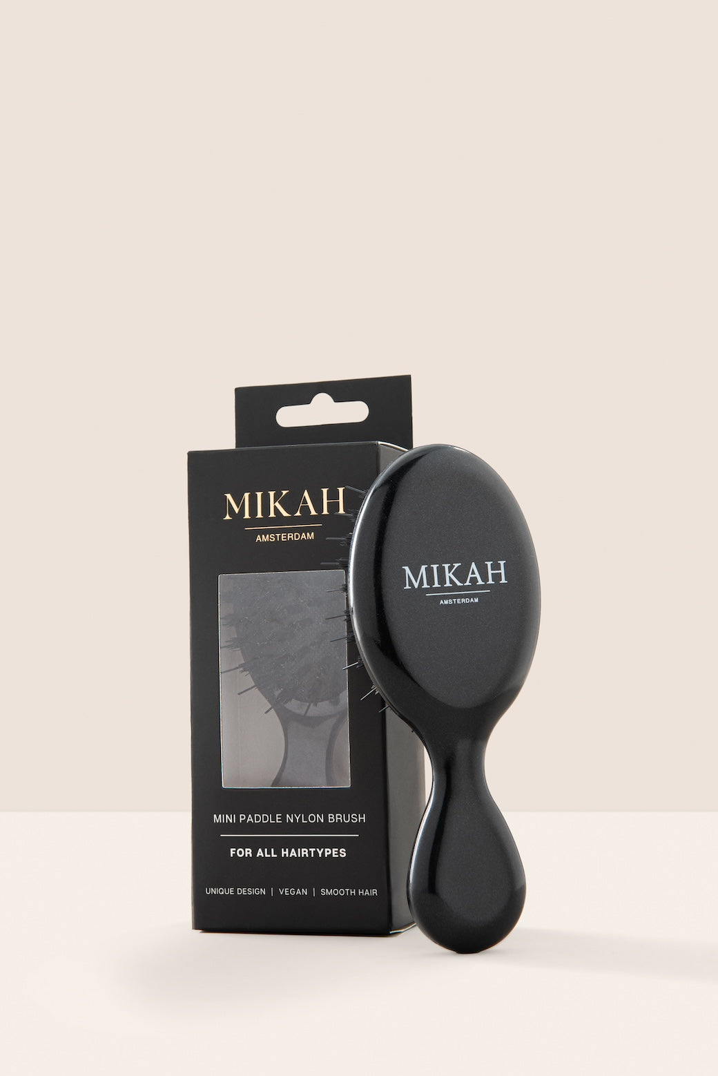 MIKAH Mini Hairbrush Black with branded product packaging