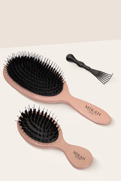 Mini Hairbrush next to Paddle Nylon Brush and Hairbrush Cleaner