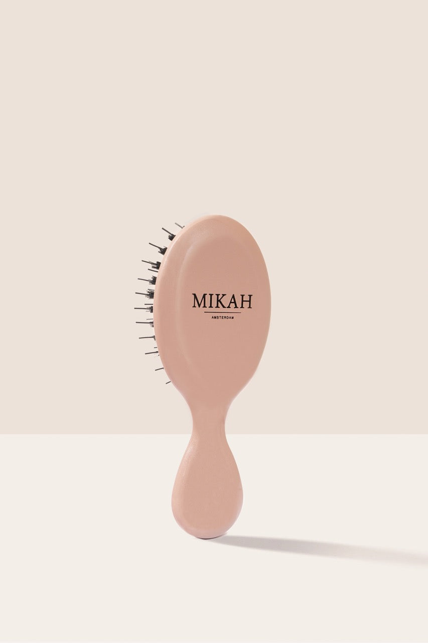 MIKAH Mini Hairbrush Pink showing its compact handle and design