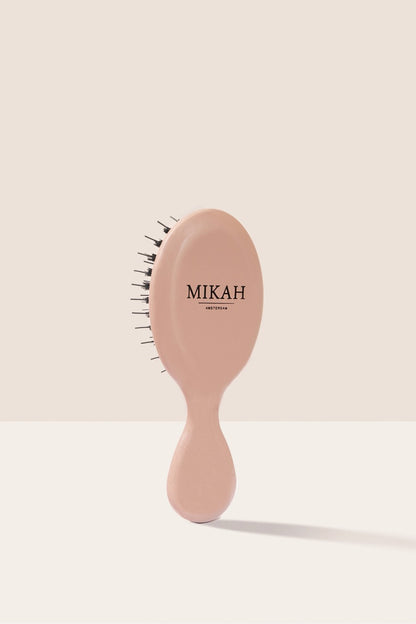 MIKAH Mini Hairbrush Pink showing its compact handle and design