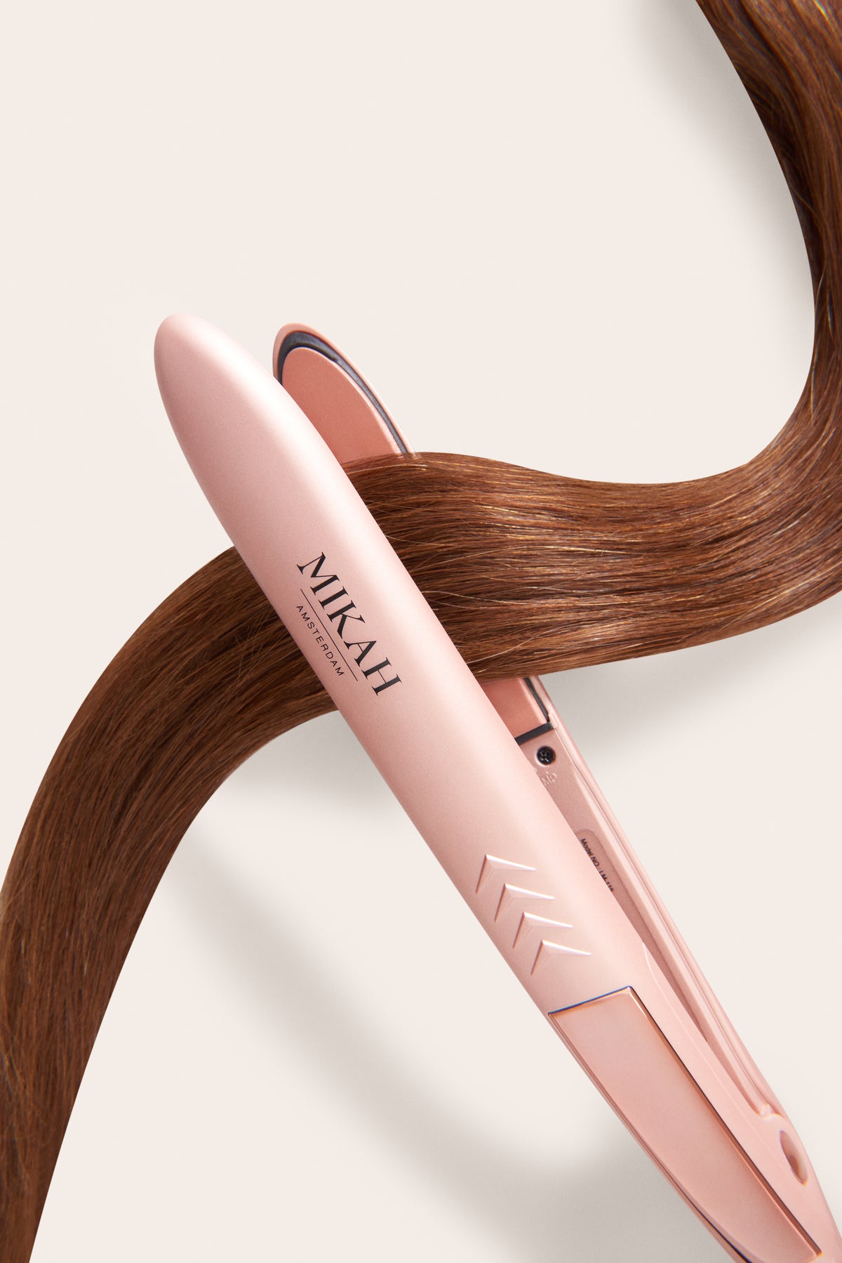 MIKAH slim ceramic flat iron styling a section of hair